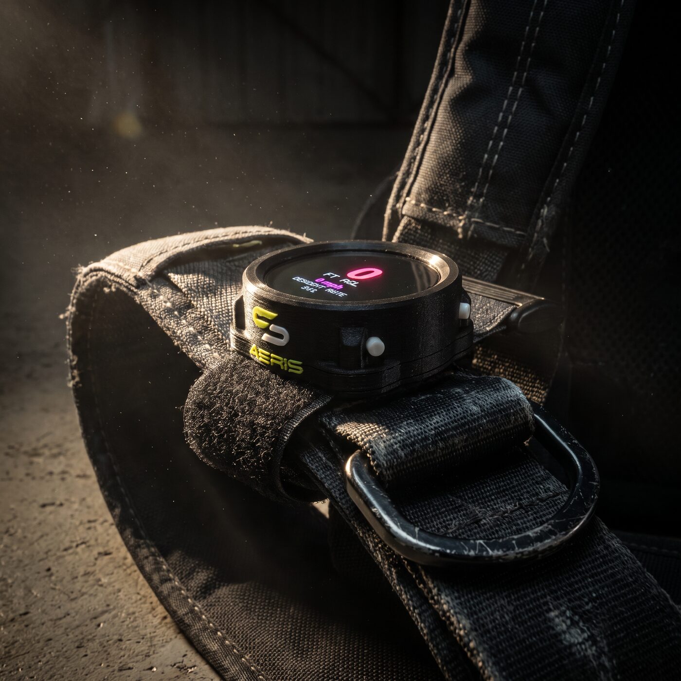 AERIS altimeter mounted on skydiving rig harness